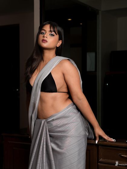 A modern take on ethnic wear, blending the elegance of a saree with a bold, boudoir-inspired look. This shows how we can create fusion concepts that are both unique and stunning.