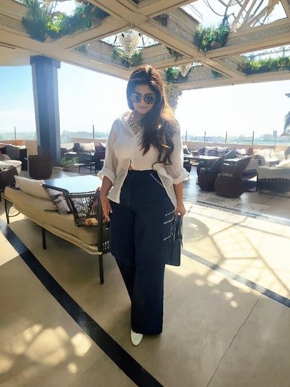 A white shirt and denim is a timeless combination, but it doesn't have to be basic. This unique white shirt with an asymmetrical cut elevates the classic look, making it fresh and chic.