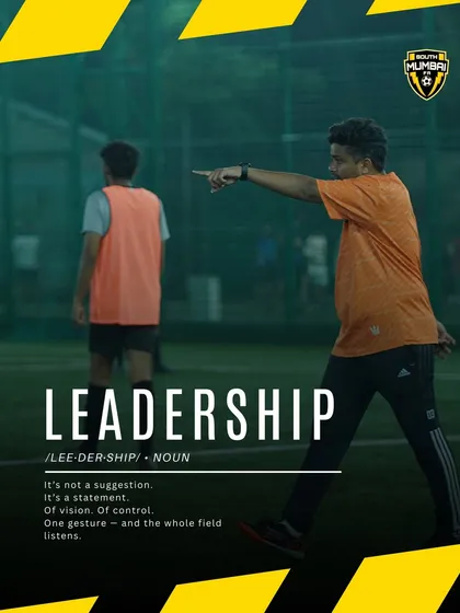 Leadership is a statement of vision and control. This image captures a coach directing his team, a moment that defines our approach to building on-field leaders.