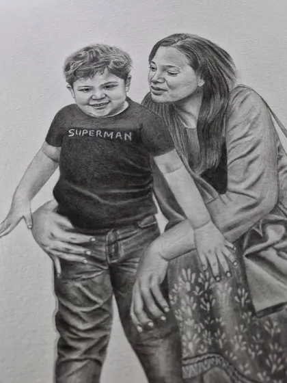 A tender moment between a mother and her son, drawn with graphite pencil. These family portraits are designed to be treasured for years.