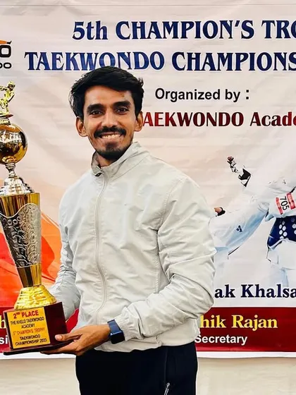 Holding our hard-earned 2nd place trophy from the Champions Trophy 2023.