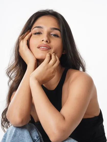 A clean and simple look for model Kashish Kapoor. This is a perfect example of 'no-makeup' makeup, focusing on perfect skin, groomed brows, and a hint of natural color on the lips.