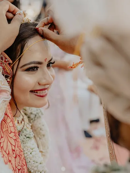The simple, profound act of applying the sindoor. We create a space where these significant rituals can be performed with reverence and emotion.