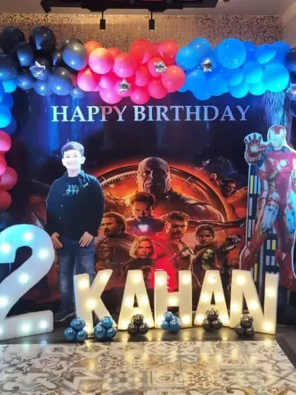 We assembled the entire Avengers team for this 12th birthday party. The stage features a dynamic backdrop with all the heroes, life-sized cutouts of Thor, Iron Man, and the Hulk, and large light-up marquee letters and numbers for a powerful, action-packed look.