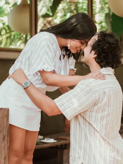 An intimate and sweet moment between a couple in a rustic Goan setting. These close-up, candid shots are perfect for capturing the quiet affection that is central to any love story.