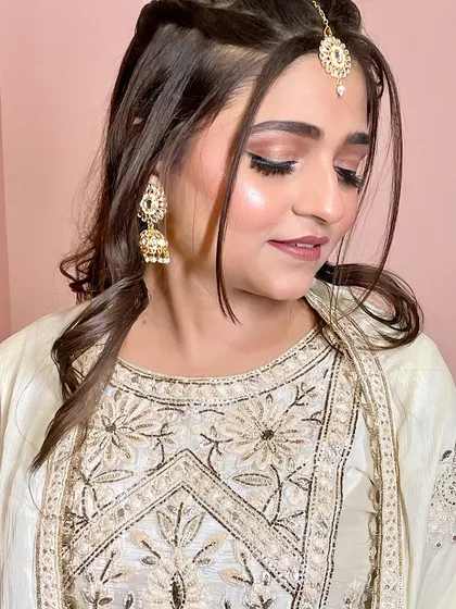 Another angle of this subtle party look, showing the flawless base and defined eyes.
