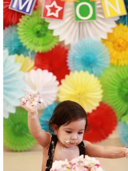 The beginning of a fun and messy cake smash session. This is a fantastic way to celebrate a first birthday, and I'm there to capture every sticky, sweet moment.