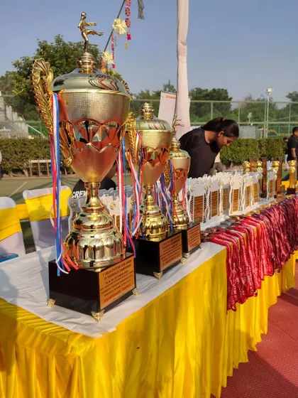 A table laden with trophies and medals at the Delhi State Taekwon-Do Championship. These are the rewards our athletes strive for.