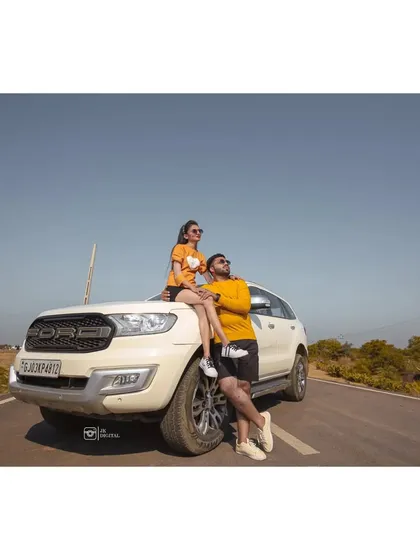 Incorporating your own vehicle, like this Ford Endeavour, can add a personal and adventurous touch to a pre-wedding photoshoot.