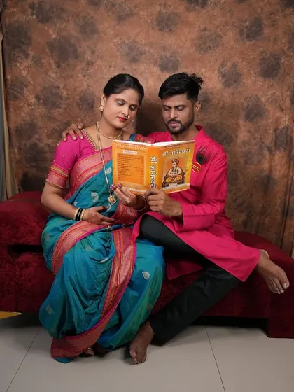 I love creating themed shots that tell a story. This couple wanted a traditional look, so we used a classic saree and kurta and added a book as a prop for a sweet, candid-style portrait.