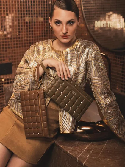 A luxurious campaign shot for Da Milano, set in a gold-tiled bathroom. I styled the model in a shimmering gold jacket, with the earthy tones of the clutch bags providing a beautiful contrast against the opulent background.