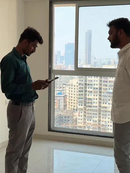 A moment during a client meeting by the window, discussing how to maximize the view and natural light in the design.