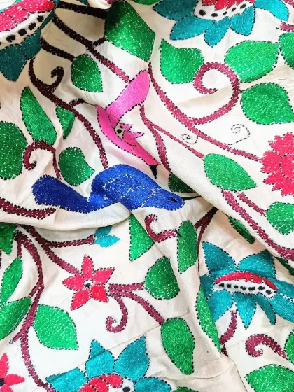 This is an exclusive, hand-embroidered Kantha dupatta on pure Bangalore silk. I have a wide collection of such unique dupattas to elevate your outfits.