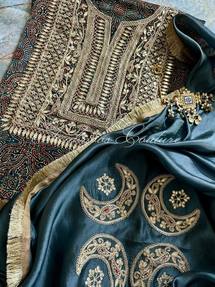 This image shows the beautiful drape of the silk organza dupatta over the detailed kurta, creating a look of sheer sophistication.