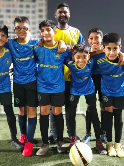 The U11s with their coach, all smiles after reaching the DPDL semi-finals. A testament to their hard work.