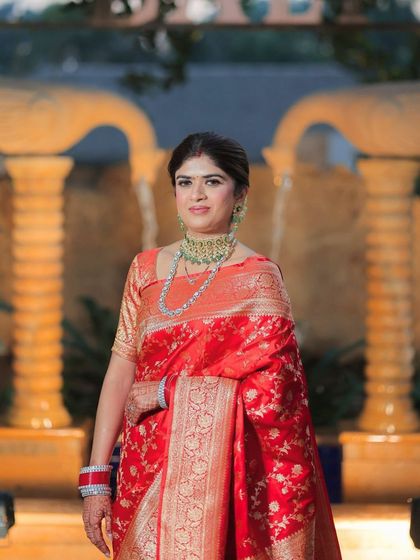 A close-up of the bride, her makeup looking flawless. The subtle look enhances her natural grace and confidence.