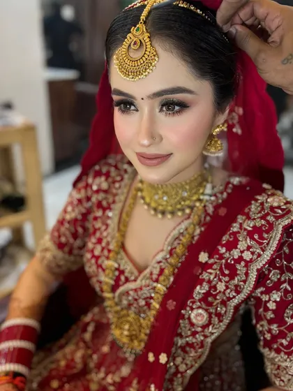 A final touch-up for my beautiful bride. We ensure every detail is perfect before she walks down the aisle.