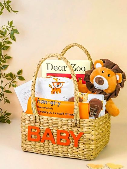 The jungle-themed gift set arranged in a personalized 'BABY' basket. This shot is great for showing a complete, ready-to-gift product.