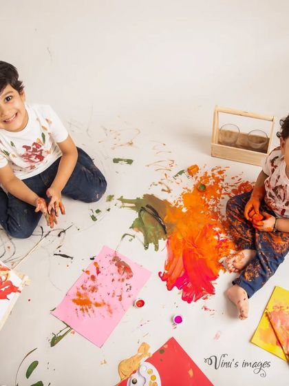 A canvas of colorful fun. This sibling photoshoot gets playfully messy with a color splash session, capturing the boys' joyful and creative energy.