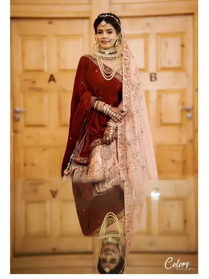 A stunning bridal portrait with a creative reflection effect, adding a touch of artistry and depth.