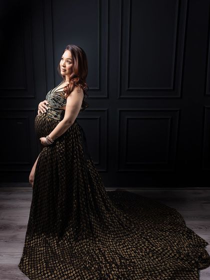 One of my most cherished images. This handcrafted black and gold dress against a Victorian-style wall is the definition of glamour.