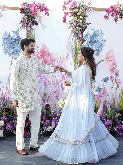 Telling a cross-cultural love story through design. For a British-Indian couple, we created the 'Victorian Bageecha' theme, blending English floral aesthetics with traditional Jaipur block prints for their rooftop mehendi.