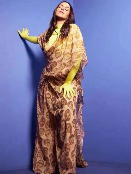 Styling is about expressing personality. This look combines a bold, artistic print with an unexpected pop of neon color, showing how we can play with fashion to create something truly unique and conversational.
