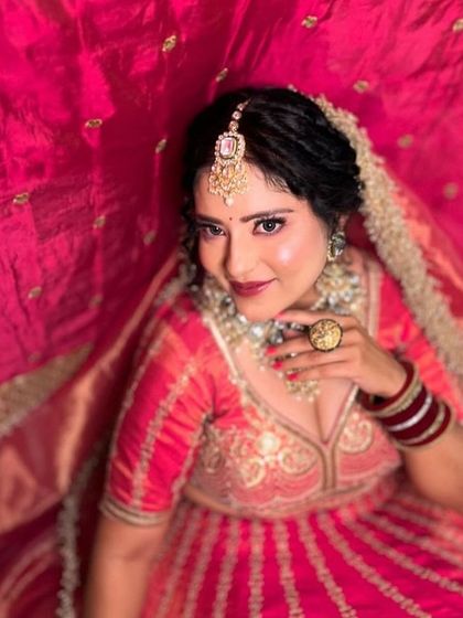 A series of images featuring a bride in a vibrant pink and gold lehenga. The different angles, from close-ups to a full flare shot, provide a comprehensive view.