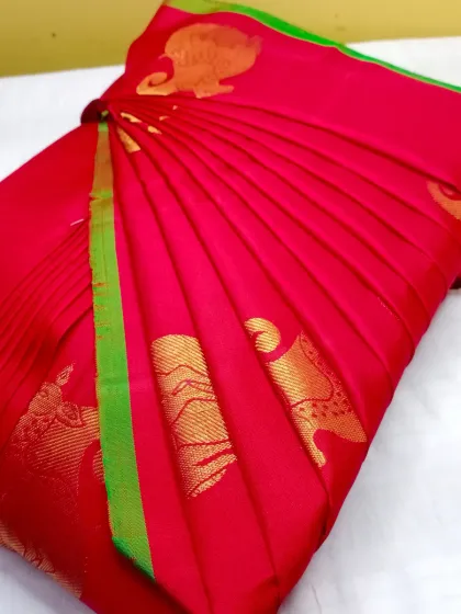 This is the result I aim for with every saree: perfectly crisp, even pleats that create a flawless drape. This vibrant red silk saree is now ready to be worn in under five minutes, making elegance effortless.