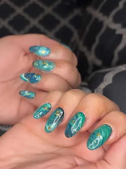 A full view of the enchanting green marble nail art.
