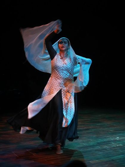 A dancer mid-performance in Sanjukta Wagh's Kathak piece at the Parabola of Dance event.