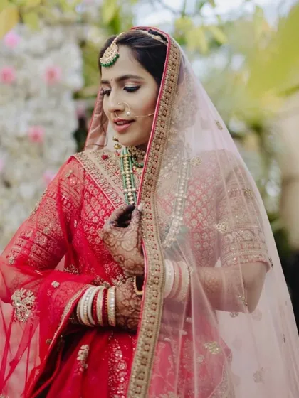 A beautiful shot of the bride with her veil. The soft glam makeup ensures she looks ethereal and timeless.