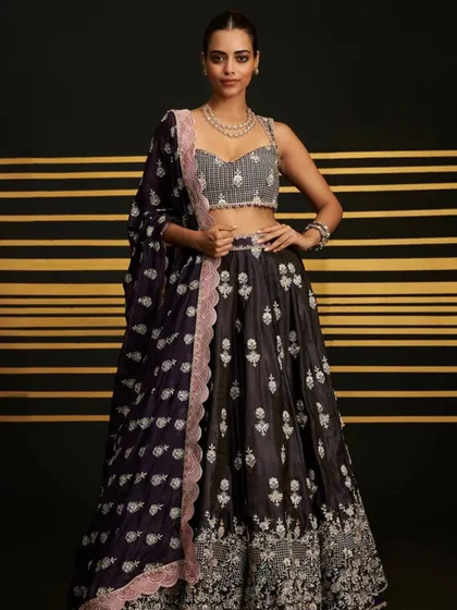 Another look at the elegant Sathi Purple Lehenga. The embellished blouse adds the perfect amount of sparkle for a cocktail event.