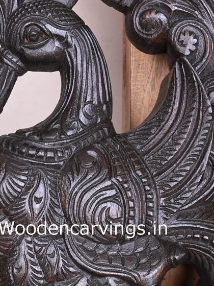 This close-up focuses on the delicate feather details of the dark brown Hamsa bracket, a testament to our artisans' patience and skill.