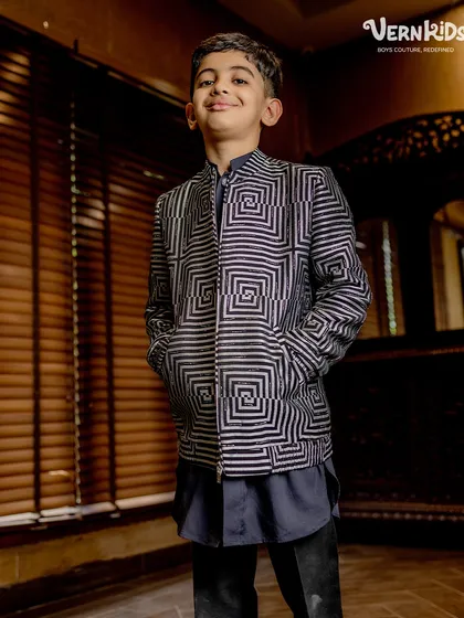This geometric print bomber jacket is a true vibe. Paired with a simple kurta, it creates a sharp, contemporary fusion look for any festive occasion.