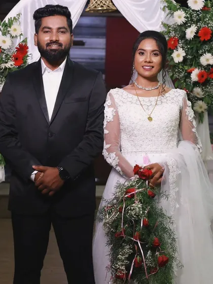 For this Christian wedding, the groom wanted a sharp, classic look to match his suit. I provided a matte, skin-like makeup finish and a hairstyle that stayed in place throughout the ceremony and reception.