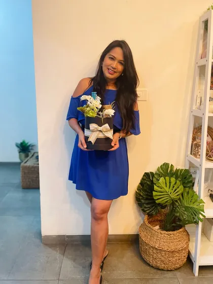 A smile is the best feedback. This client is delighted with her personalized hamper, delivered right to her doorstep.