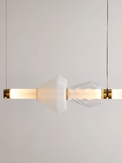 This close-up highlights the delicate, rippled texture of the clear glass elements in the Luna Kaleido series, showcasing the fine craftsmanship.