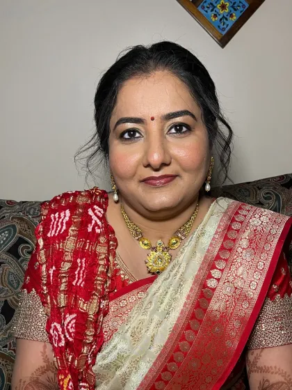 A close-up of the guest's makeup. The look is timeless and enhances her natural features beautifully.