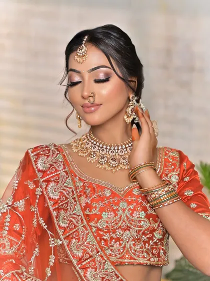 A candid moment that highlights the hathphool and bangles, showing how I can provide a complete set of coordinated jewellery for your hands, tying the whole look together.