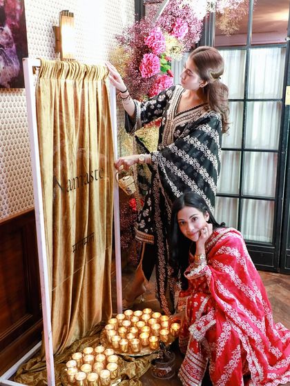 Guests enjoying the festive decor at the Diwali collection launch.