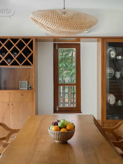 The dining table is the heart of many homes. This setting features one of my signature live-edge teak tables, paired with classic rattan dining chairs. The natural edge of the wood means every table is unique, bringing organic warmth to your meals.