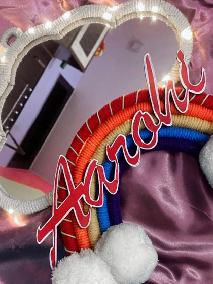 Another look at the 'Aarohi' cloud mirror, showing the reflection and the soft glow of the integrated fairy lights.