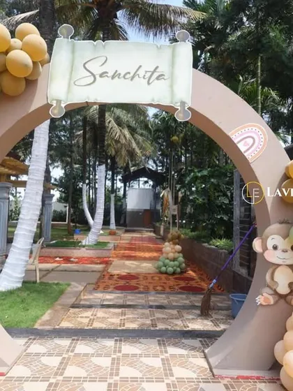 A welcoming entrance arch for Sanchita's party, decorated with pastel balloons and cute animal cutouts like a bunny and monkey to set a friendly tone.