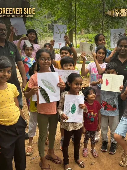 A group of proud kids shows off their leaf rubbing art from a nature journaling event. This activity helps them appreciate the different shapes, sizes, and textures of leaves, fostering a deeper connection with trees.