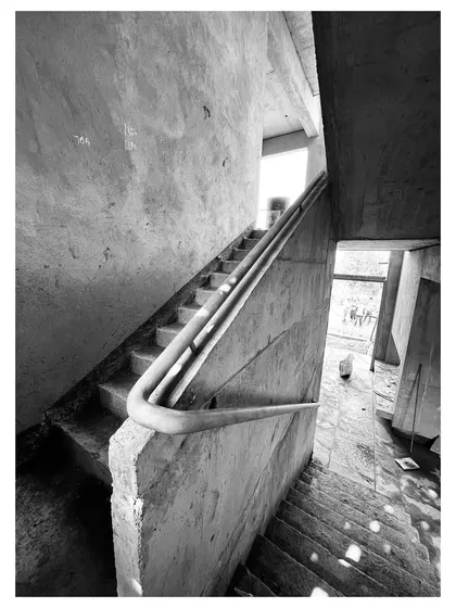 This view shows the complex geometry of the staircase during construction, revealing the structural logic that is often hidden in the finished building.