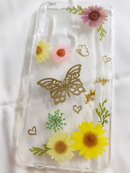 A phone case that's as unique as you are. For this custom order, I arranged a delicate garden of real dried flowers and butterfly accents. Each floral phone cover is a one-of-a-kind piece of art.