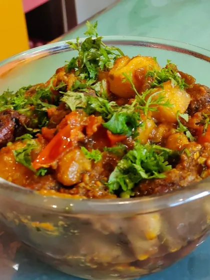 Here is a closer look at the texture and ingredients of our homemade Undhiyu. You can see the blend of fresh, seasonal vegetables and aromatic spices that makes this dish a beloved festive classic.