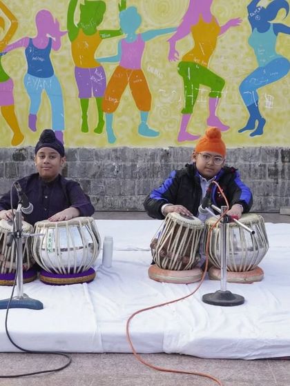 A pair of our younger students performing a tabla duet, demonstrating that talent knows no age.