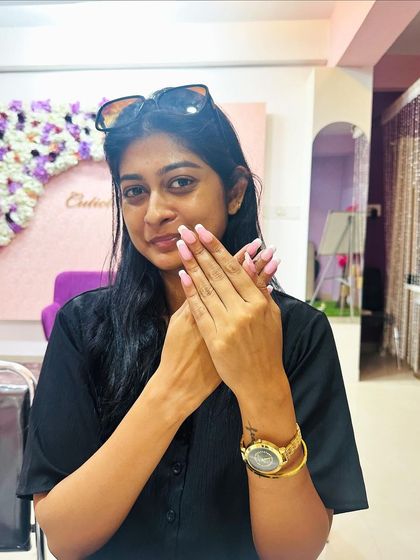 Another shot of a satisfied client showing off her fresh set of pink nails.